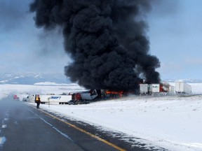 Smoke rises in the aftermath of a chain-reaction crash along Interstate 80 near Laramie, Wyo., April 20, 2015.