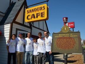 In this Saturday, April 4, 2015 photo, from left, Jason Lutfy, Sebastien Pitre, Neil Janna, Jesse Janna, Josh Janna and Brian Lutfy, from Montreal, pose for a photo outside the Harland Sanders Cafe and Museum in Corbin, Ky. The friends left Montreal on Thursday, traveling to Col. Sanders' birthplace and burial place before arriving at the Corbin restaurant Saturday afternoon.