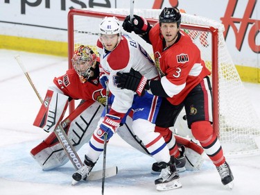 Montreal Canadiens forward Lars Eller (81) tries to screen Ottawa Senators goalie Craig Anderson as defenceman Marc Methot (3) defends during the second period of game 3 of first round Stanley Cup NHL playoff hockey action in Ottawa on Sunday, April 19, 2015.