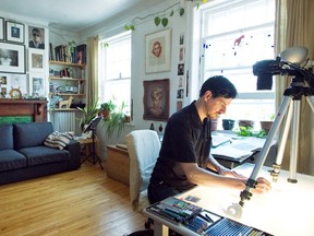 G. Scott MacLeod works at the animation drawing desk in his living room in May 2014.