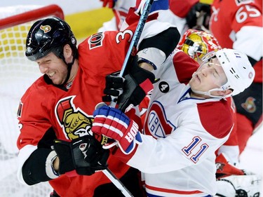 Ottawa Senators defenceman Marc Methot (3) battles in front of the net with Montreal Canadiens forward Brendan Gallagher (11) during the third period of game 3 of first round Stanley Cup NHL playoff hockey action in Ottawa on Sunday.
