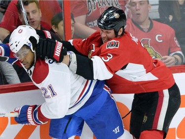 Ottawa Senators defenceman Marc Methot (3) hits Montreal Canadiens forward Devante Smith-Pelley (21) during the second period of game 3 of first round Stanley Cup NHL playoff hockey action in Ottawa on Sunday, April 19, 2015.