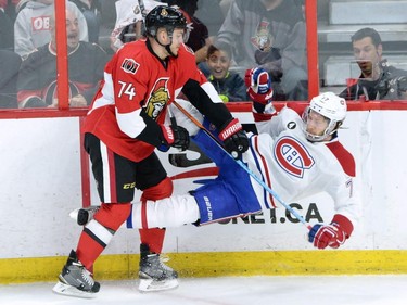 Ottawa Senators forward Mark Borowiecki (74) hits Montreal Canadiens defenceman Tom Gilbert (77) during the first period of game 3 of first round Stanley Cup NHL playoff hockey action in Ottawa on Sunday, April 19, 2015.