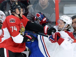 Ottawa Senators forward Mark Borowiecki hits the Canadiens' Tom Gilbert during Game 3 of Eastern Conference quarter-final series on April 19, 2015.