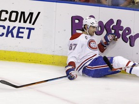 Canadiens' Max Pacioretty falls on the ice during the first period of an NHL  game against the Florida Panthers on Sunday, April 5, 2015, in Sunrise, Fla.