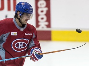Montreal Canadiens' Max Pacioretty juggles a puck with his stick during a practice, Monday, April 13, 2015 in Brossard, Que.