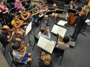 “They are all as committed as I am about erasing that stigma of mental illness from society,” notes conductor Ronald Braunstein, far right, of Me2 Orchestra's musicians.