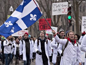 Medical students from four major Quebec universities demonstrate against Bill 20 on health, Monday, March 30, 2015 near the legislature in Quebec City.