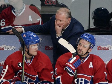 Montreal Canadiens head coach Michel Therrien and players Jacob De La Rose,left, Tomas Plekanec, center, and Brendan Gallagher, right, watch the final seconds of their 5-1 loss to the Ottawa Senators in thir period of Game 5 NHL first round playoff hockey action Friday, April 24, 2015 in Montreal.THE CANADIAN PRESS/Ryan Remiorz