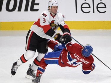Montreal Canadiens' Brendan Gallagher is hit by Ottawa Senators' Marc Methot during first-period playoff action in Montreal, Wednesday, April 15, 2015.