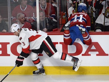 Montreal Canadiens' Brendan Gallagher misses his check on Ottawa Senators' Marc Methot during first-period playoff action in Montreal on Wednesday, April 15, 2015.