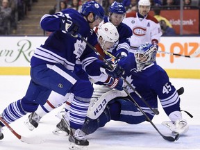 Montreal Canadiens' Brendan Gallagher scores on Toronto Maple Leafs goalie Jonathan Bernier during third period NHL action in Toronto on Saturday, April 11, 2015. The goal was called back because of goalie interference.