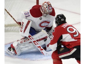 Montreal Canadiens' Carey Price stops Ottawa Senators' Mika Zibanejad (93) during second period Stanley Cup NHL playoff hockey action in Ottawa on Wednesday, April 22, 2015.