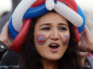 Montreal Canadiens fan Khatira Akbari cheers on her team ahead of game 3 of first round Stanley Cup NHL playoff hockey between the Ottawa Senators and the Montreal Canadiens in Ottawa on Sunday, April 19, 2015.