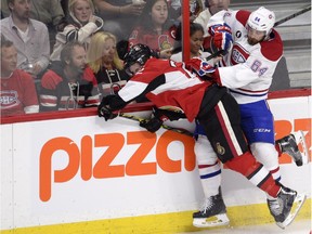 Canadiens defenceman Greg Pateryn checks the Ottawa Senators' Erik Condra into the boards during Game 4 of Eastern Conference quarter-final series on April 22 in Ottawa.