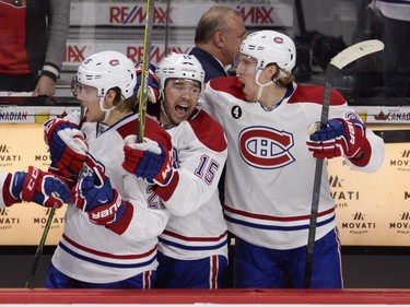 Montreal Canadiens' Jacob de la Rose, left to right, Pierre-Alexandre Parenteau and Dale Weise celebrate their victory over the Ottawa Senators during third period NHL playoff action in Ottawa, Sunday, April 26, 2015.
