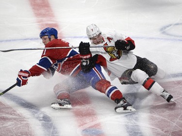Montreal Canadiens' Lars Eller and Ottawa Senators' Kyle Turris battle for the puck at centre ice during first- period playoff action in Montreal, Wednesday, April 15, 2015.