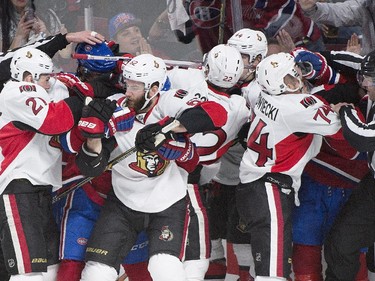 Players from the Ottawa Senators and th Montreal Canadiens fight during third period of Game 5 NHL first round playoff hockey action in Montreal, Friday, April 24, 2015.