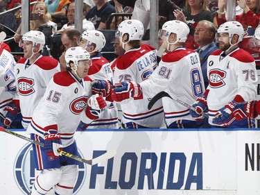 P.A. Parenteau of the Montreal Canadiens is congratulated by teammates after scoring a second-period goal against the Florida Panthers on April 5, 2015, in Sunrise, Fla.