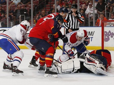 Goaltender Dan Ellis of the Florida Panthers stops a shot by Brendan Gallagher of the Montreal Canadiens during first-period action on April 5, 2015, in Sunrise, Fla.
