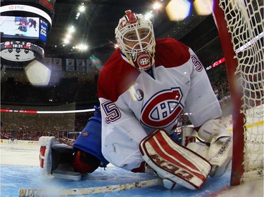 Dustin Tokarski #35 of the Montreal Canadiens keeps his eyes on the puck during the first period against the New Jersey Devils at the Prudential Center on April 3, 2015 in Newark, New Jersey.