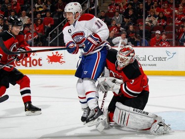Keith Kinkaid #1 of the New Jersey Devils is screened by Brendan Gallagher #11 of the Montreal Canadiens during the third period at the Prudential Center on April 3, 2015 in Newark, New Jersey. The Devils defeated the Canadiens 3-2 in the shootout.