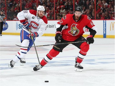OTTAWA, ON - APRIL 22: Eric Gryba #62 of the Ottawa Senators races against Brandon Prust #8 of the Montreal Canadiens for the puck in Game Four of the Eastern Conference Quarterfinals during the 2015 NHL Stanley Cup Playoffs at Canadian Tire Centre on April 22, 2015 in Ottawa, Ontario, Canada.
