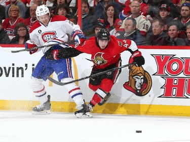 Jean-Gabriel Pageau #44 of the Ottawa Senators battles for control of the puck against Jeff Petry #26 of the Montreal Canadiens in Game Four of the Eastern Conference Quarterfinals during the 2015 NHL Stanley Cup Playoffs at Canadian Tire Centre on April 22, 2015 in Ottawa, Ontario, Canada.