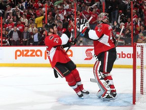 Senators goalie Craig Anderson celebrates  with teammate Chris Neil after winning Game 4 of Eastern Conference quarter-final series against the Canadiens 1-0 on April 22 in Ottawa.