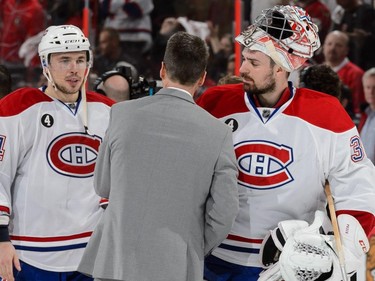 OTTAWA, ON - APRIL 26: Goaltender Carey Price #31 of the Montreal Canadiens shakes hands with Senator's head coach Dave Cameron in Game Six of the Eastern Conference Quarterfinals during the 2015 NHL Stanley Cup Playoffs at Canadian Tire Centre on April 26, 2015 in Ottawa, Ontario, Canada. The Montreal Canadiens eliminated the Ottawa Senators by defeating them 2-0 and move to the next round of the playoffs.