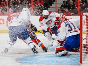 Goaltender Carey Price #31 makes a save as teammate P.K. Subban #76 of the Montreal Canadiens defends in Game Six of the Eastern Conference Quarterfinals against the Ottawa Senators during the 2015 NHL Stanley Cup Playoffs at Canadian Tire Centre on April 26, 2015 in Ottawa, Ontario, Canada.