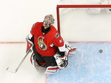 Craig Anderson #41 of the Ottawa Senators reacts after allowing the overtime goal by the Montreal Canadiens as Milan Michalek #9 of the Ottawa Senators in Game Three of the Eastern Conference Quarterfinals during the 2015 NHL Stanley Cup Playoffs at Canadian Tire Centre on April 19, 2015 in Ottawa, Ontario, Canada.