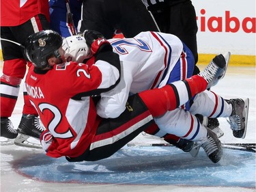 OTTAWA, ON - APRIL 19: Erik Condra #22 of the Ottawa Senators gets tackled to the ice by Jeff Petry #26 of the Montreal Canadiens in Game Three of the Eastern Conference Quarterfinals during the 2015 NHL Stanley Cup Playoffs at Canadian Tire Centre on April 19, 2015 in Ottawa, Ontario, Canada.