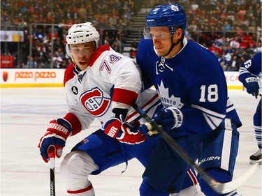Richard Panik #18 of the Toronto Maple Leafs gets past Alexei Emelin #74 of the Montreal Canadiens during NHL action at the Air Canada Centre April 11, 2015, in Toronto.