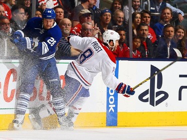 Colton Orr #28 of the Toronto Maple Leafs runs into Brandon Prust #8 of the Montreal Canadiens during NHL action at the Air Canada Centre April 11, 2015, in Toronto.