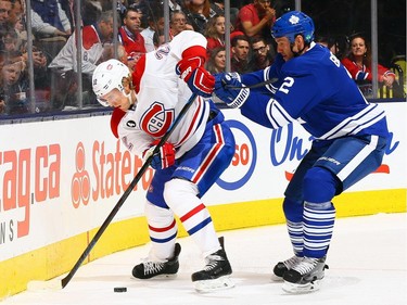 Eric Brewer #2 of the Toronto Maple Leafs battles for the puck against Dale Weise #22 of the Montreal Canadiens during NHL action at the Air Canada Centre April 11, 2015, in Toronto.