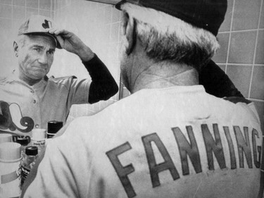 Montreal Expos' newly named manager, Jim Fanning, adjusts his cap prior to taking the field for a game against the Philadelphia Phillies in Philadelphia on Sept. 8, 1981.