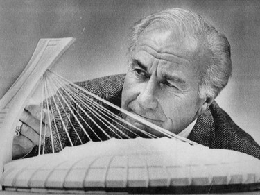 Montreal Expos vice-president Jim Fanning gets a close up view of a model of the completed Olympic Stadium after a news conference on Sept. 16, 1986, explaining the workings of the new roof.