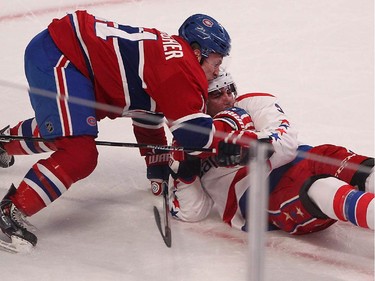 Montreal Canadiens' Brendan Gallagher brings down Washington Capitals' Matt Niskanen, right, during first period NHL action in Montreal on Thursday April 2, 2015.
