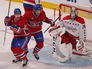 Montreal Canadiens' Brendan Gallagher, left, and Alex Galchenyuk celebrates goal by Jeff Petry, on Washington Capitals goalie Braden Holtby, during second period NHL action in Montreal on Thursday April 2, 2015.