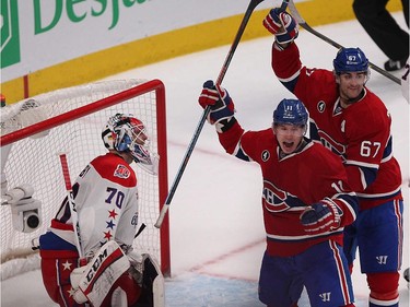 Montreal Canadiens' Brendan Gallagher and Max Pacioretty, right, celebrate goal by P.K. Subban in front of Washington Capitals' Braden Holtby, during third period NHL action in Montreal on Thursday April 2, 2015.