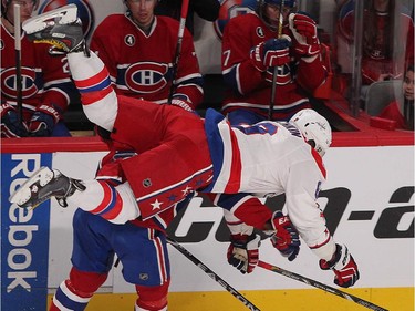 Washington Capitals' Alex Ovechkin goes over Montreal Canadiens' P.K. Subban, during first period NHL action in Montreal on Thursday April 2, 2015.