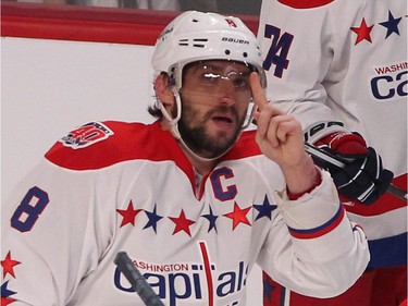 Washington Capitals' Alex Ovechkin brings up to the sky his fingers after he scored his 51st goal of the year during second period NHL action against Montreal Canadiens in Montreal on Thursday April 2, 2015.