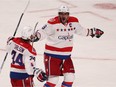 Capitals' Alex Ovechkin celebrates a goal with teammate John Carlson, during third-period action on Thursday April 02, 2015, at the Bell Centre.