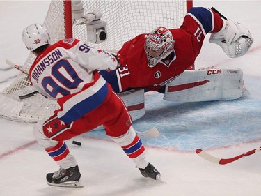 Washington Capitals' Marcus Johansson tries for rebound on Montreal Canadiens goalie Carey Price, during second period NHL action in Montreal on Thursday April 2, 2015.