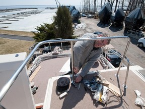 Boat owner gets his boat ready at the Lord Reading Yacht Club in Beaconsfield.