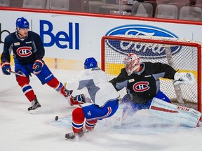 Left to right: Montreal Canadiens players Nathan Beaulieu, Devante Smith-Pelly, and goalie Carey Price take part in a team practice at the Bell Centre in Montreal on Wednesday, April 1, 2015.