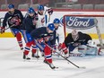 Montreal Canadiens goalie Carey Price keeps his eye on the puck as teammates take part in a team practice at the Bell Centre in Montreal on Wednesday, April 1, 2015. The Canadiens will face the Washington Capitals on April 2.