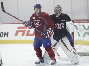 Brendan Gallagher of the Canadiens crowds goalie Carey Price during practice at the Bell Sports Complex in Brossard on April 13, 2015.