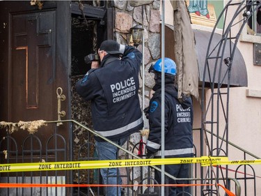 Police arson investigators at the scene of the overnight fire at the Koimisis Tis Theotokou Greek Orthodox Church, also called Panagitsa, in Parc-Extension April 14, 2015.